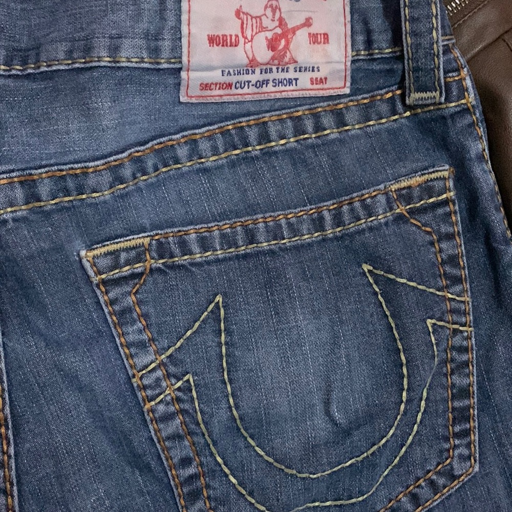 True religion cutoff jean shorts. Size 34, taper in at bottom
